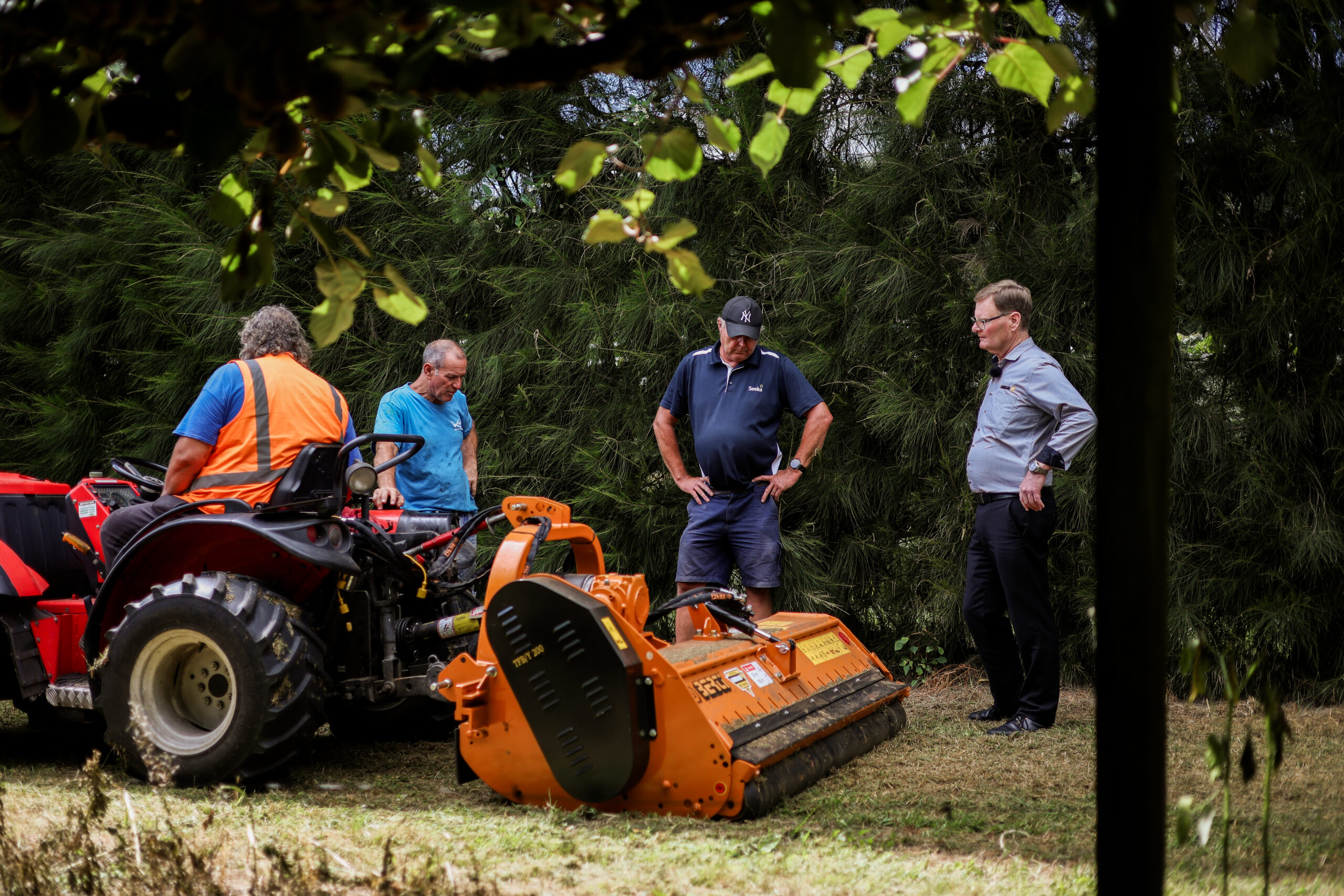 Berti Mulcher New Zealand running in a kiwifruit orchard